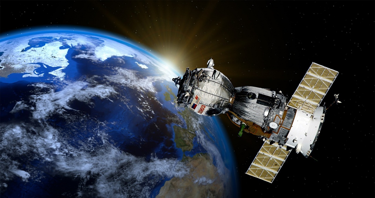 Satellites navigating through a ring system
